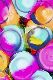 Colorful Design Prints: An array of vibrant, abstract ink patterns featuring a mixture of bright pink