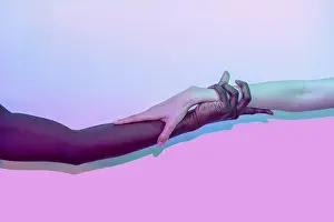 Vibrant Gradient Background Prints: Artistic composition of multiethnic hands touching against a vibrant gradient background