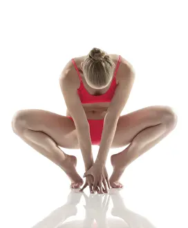 Athletic Pose Prints: Artistic gymnast performs exercises in studio