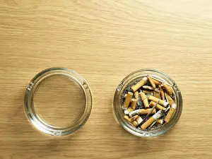 Copy Space Images Prints: Empty and full ash trays