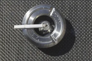 Smoking Health Risks Prints: Ashtray with a cigarette