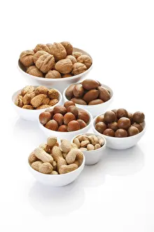 Assorted Nuts Prints: Assorted nuts in ceramic bowls
