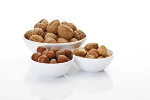 Close Up Photography Prints: Assorted nuts in ceramic bowls