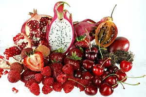 Close Up Macro Prints: Assorted red fruit on white background