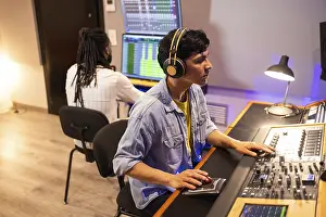 Recording Studio Atmosphere Prints: Two audio engineers work in a recording studio
