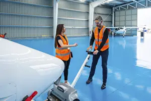 Aircraft Maintenance Prints: Aviation engineers collaborating