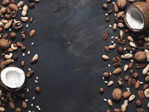 Dark Background Copy Space Prints: Background of mixed nuts - coconut