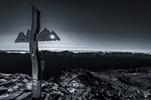 Deserted Mountain Valley Scene Prints: Backlit summit cross of the Lyfispitze