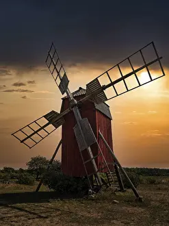 Scandinavian Tourist Attraction Prints: Backlit trestle windmill, dramatic evening sky