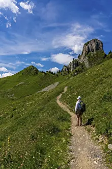 Mountainous Scenery Photos Prints: Backpacker in the Swiss mountains