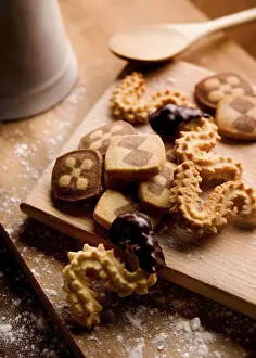 Unhealthy Sweets Prints: Baking biscuits, board with various biscuits in kitchen