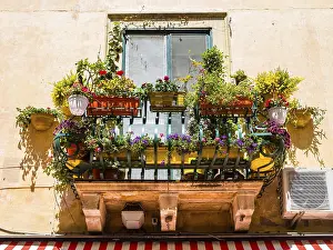 Prints of Balcony arrayed with colorful flowers, Piazza Duomo, historic center, Taormina, Sicily, Italy Taormina Prints: Balcony with Colorful Flowers Print, Taormina, Sicily
