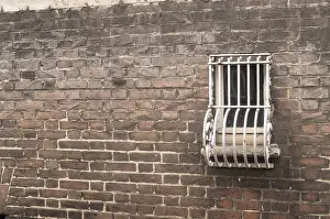 Images Dated 17th August 2024: Barred small window on a brick wall Print
