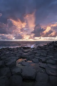 Basalt Stone Formations Prints: Basalt columns by the coast at sunset