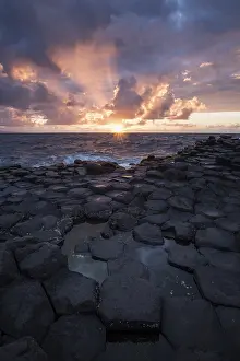 Irish Coastline Scenery Prints: Basalt columns by the coast at sunset