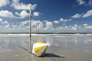 German Beaches Prints: Beach, marker posts and a buoy