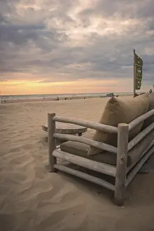 Evening Sun On The Coast Prints: Beach Sofa on the beach at sunset