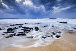 Spanish Coastal Scene Prints: Beach with stones, waves and clouds