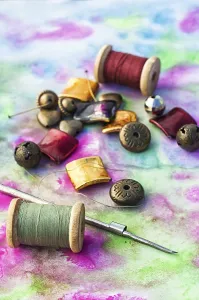 Handicraft Tools Prints: Beads and tools for needlework on bright background