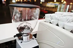 Deserted Coffee Shop Prints: Beans in the grinder in coffee bar