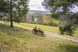Electric Bicycle Ride Prints: A bench with a bicycle in front of it