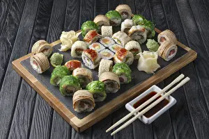 Seafood Dishes Prints: Big set of rolls served on stone plate