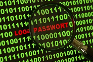 Computer Hacking Crime Prints: Binary code with the words 'Login Passwort' viewed through a magnifying glass Binary code with the words