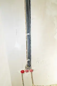Power Supply Lines Prints: Black cable ducts inserted into the wall
