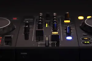 Professional Audio Equipment Prints: A black DJ mixer with various buttons and knobs
