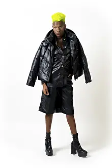 Studio Shot Of A Young Man Prints: Black ethnic man in studio with white background