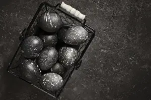 Black Painted Eggs Prints: Black painted eggs for Easter in a basket