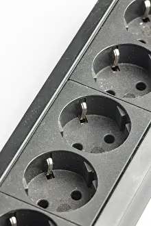 Power Industry Equipment Prints: Part of a black plastic socket strip with empty sockets