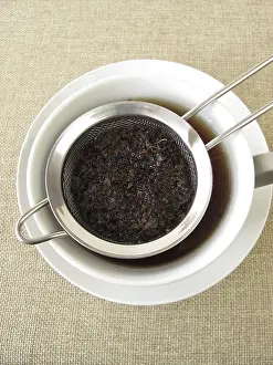 Black Tea Prints: Black tea in a tea strainer