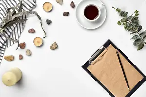 Education Background Prints: Blank opened notebook with cup of coffee on white table