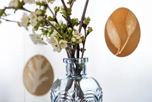 Blue And White Blossoms Prints: Blown out Easter eggs, in the background a light blue vase with blossoming branches