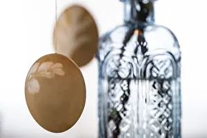Colourful Easter Decorations Prints: Blown out Easter eggs, a light blue vase in the background