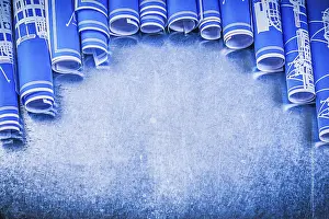 Blue Engineering Drawings Prints: Blue engineering drawings on metallic background construction concept