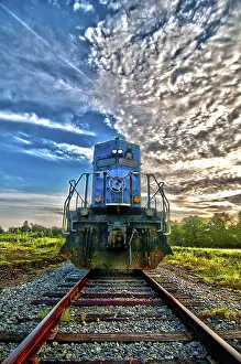 Sunrise Rail Traffic Prints: Blue freight train engine at sunrise