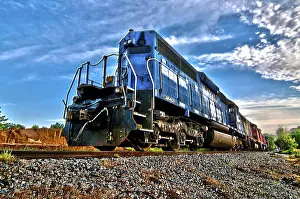 Sunrise Rail Traffic Prints: Blue freight train engine at sunrise