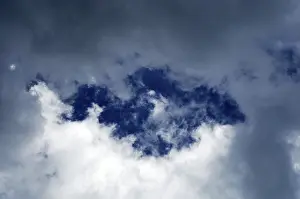 Atmospheric Mood Images Prints: Blue sky between dark clouds