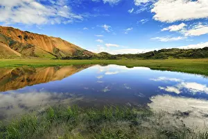 Blue Sky Reflection Prints: Blue sky and white clouds reflected in water surface