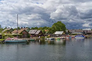 Prints of Boat cruise shops along Lake Galve in Trakai, Lithuania Lake Prints: Boat Cruise Shops Print along Lake Galve, Trakai