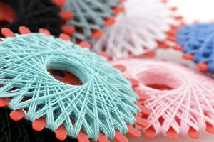 Colorful Threads Prints: Many bobbins with different colored threads for sewing