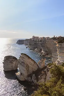 Deserted Cityscape At Sunset Prints: Bonifacio with its limestone cliffs in the foreground