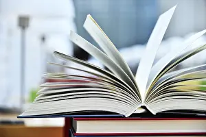 Religious Texts In Libraries Prints: Books lying on the table in the public library