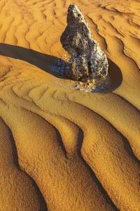 Middle East Rock Formations Prints: Boulders surrounded by wind-blown sand structures
