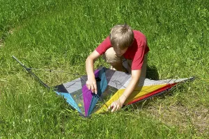 Handicrafts For Kids Prints: Boy assembles a stunt kite
