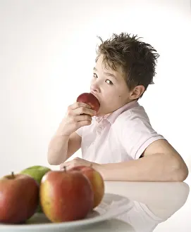 Balanced Diet For Kids Prints: A boy biting into a red apple