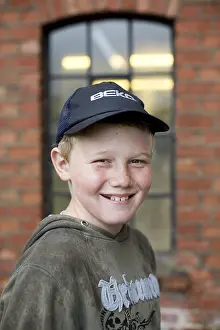 Child Looking At Camera Prints: Boy with caps