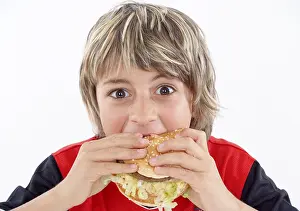 Unhealthy Snack Choices Prints: Boy eats hamburger